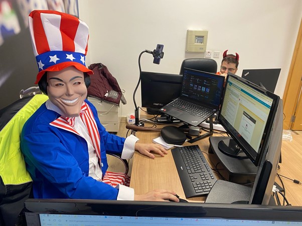 Man sitting at desk wearing Uncle Sam costume